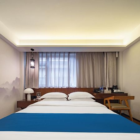 張家界武陵源北岸輕奢客棧 森林公園店 Hotel Zhangjiajie Buitenkant foto